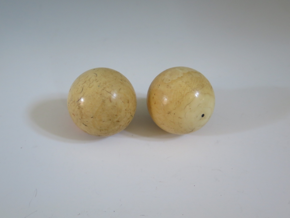 Two Ivory Billiard Balls