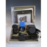 A Rolleiflex SLX boxed set with Planar 1:2.8 f=80mm lense and accessories, in original box and