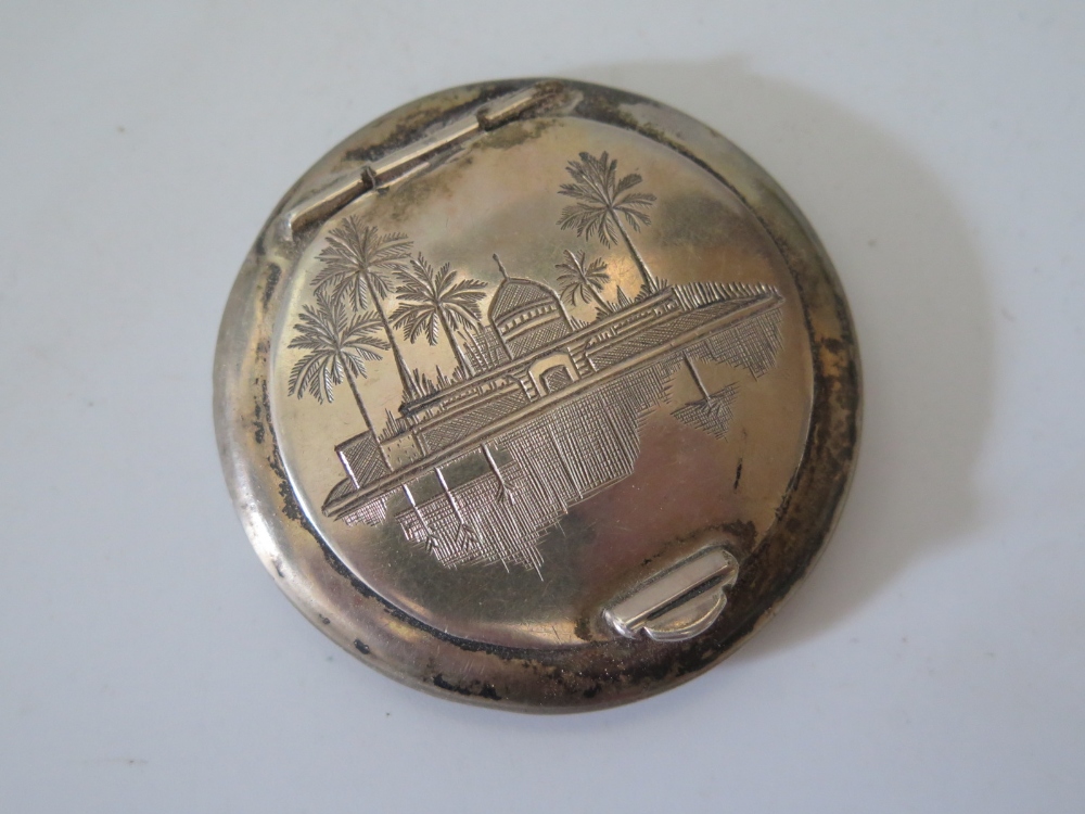 An Iraqi Silver Compact decorated with building and palm trees