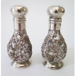A Small Pair of Chinese Silver Mounted Cruets decorated with prunus, 8.5cm