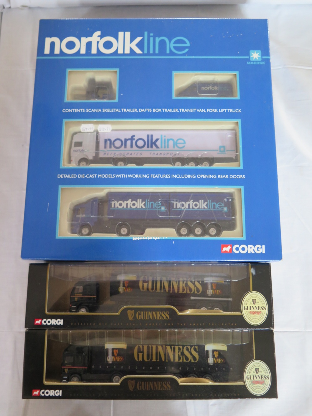 A Corgi Norfolk Lines Boxed Set and two Guinness articulated lorries