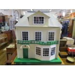A LARGE DOLLS HOUSE