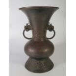 An Early Chinese Bronze Red Splash Two Handled Vase, 26cm