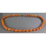 An Amber Bead Necklace, 60g