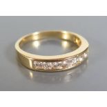 An 18ct Yellow Gold Diamond Half Eternity Ring set with seven diamonds, c. 0.5ct, size O.5, 3g