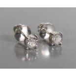 A Pair of Diamond Screw Back Stud Earrings, c. 0.25ct