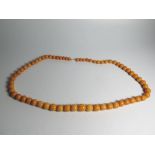 A Large Amber Bead Necklace, 102.9g