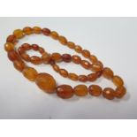 A Faceted Amber Bead Necklace, 42.9g