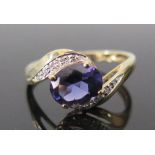 A Tanzanite and Diamond Ring in a 9ct yellow gold setting, size S