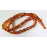 A Faceted Amber Bead Necklace, 32.5g