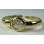 A Lady's 14ct Gold Bangle Watch