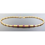 A Handmade 23ct Gold and Ruby Necklace, 17cm, 16g