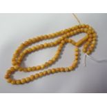 An Amber Bead Necklace, 19.8g