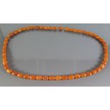 An Amber Bead Necklace, 49.4g
