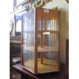 CAROUSEL GLAZED DISPLAY CABINET AND A JAPANESE STYLE MANTLE CLOCK