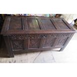 An Eighteenth Century Carved Oak Coffer, 143 cm