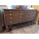 An Oak Bank of Eight Drawers on later stand