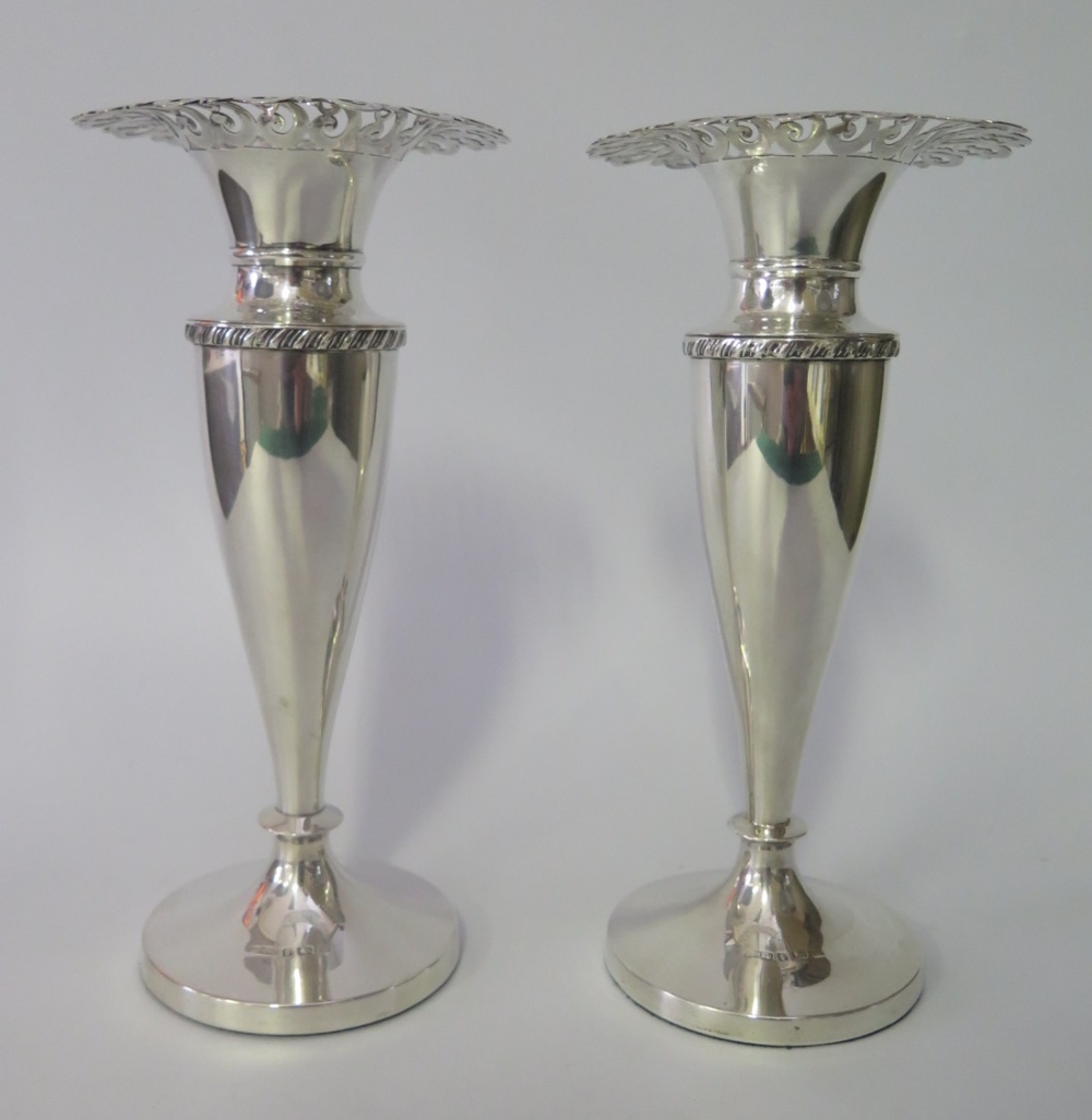 A Pair of Victorian Loaded Silver Vases with pierced s-scroll foliate rims, Birmingham 1900, John