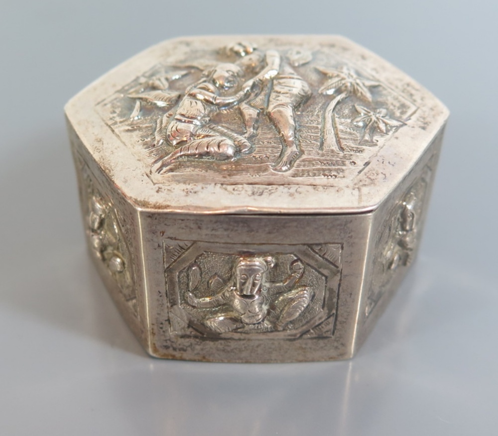 An Indian White Metal Hinged Box decorated with Hindu deities, 6.5cm diam., 64g