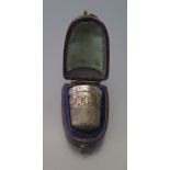 A Sterling Silver Thimble in leather presentation case