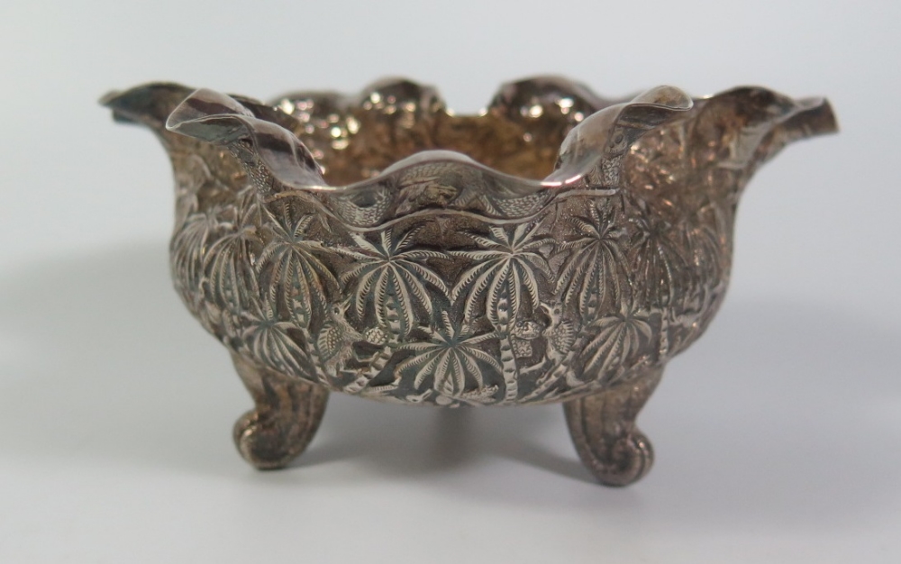 An Indian White Metal Trefoil Shaped Bowl decorated with palms and animals, 235g