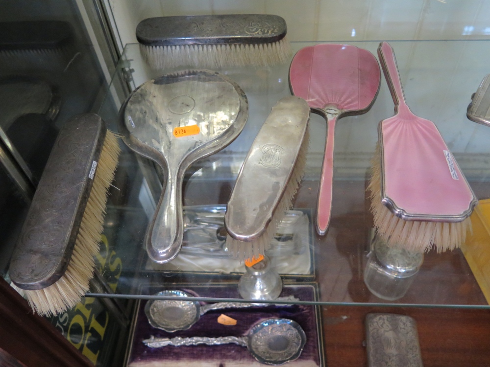 Six Silver Backed Hand Mirrors and Brushes