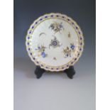 A Caughley Porcelain Saucer Dish with lobed rim and gilt, puce and blue floral decoration c. 1785,