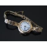 9ct Gold Lady's Wristwatch on 9ct gold bracelet, running, 21.7g inc.