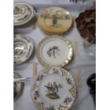 A Nineteenth Century Berlin Plate decorated with birds, set of four Royal Worcester fish decorated