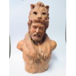 A Terracotta Bust of Hecules wearing the skin of Nemean Lion, 67cm high