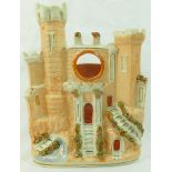 A Victorian Staffordshire pottery flatback pocket watch stand in the form of a castle,