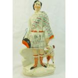 A Victorian Staffordshire pottery flatback figure of the Prince of Wales with a dog,