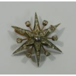 A Victorian gold and silver diamond set star brooch,