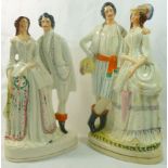 Two Victorian Staffordshire pottery flatbacks of couples, the first with the lady holding a parasol,