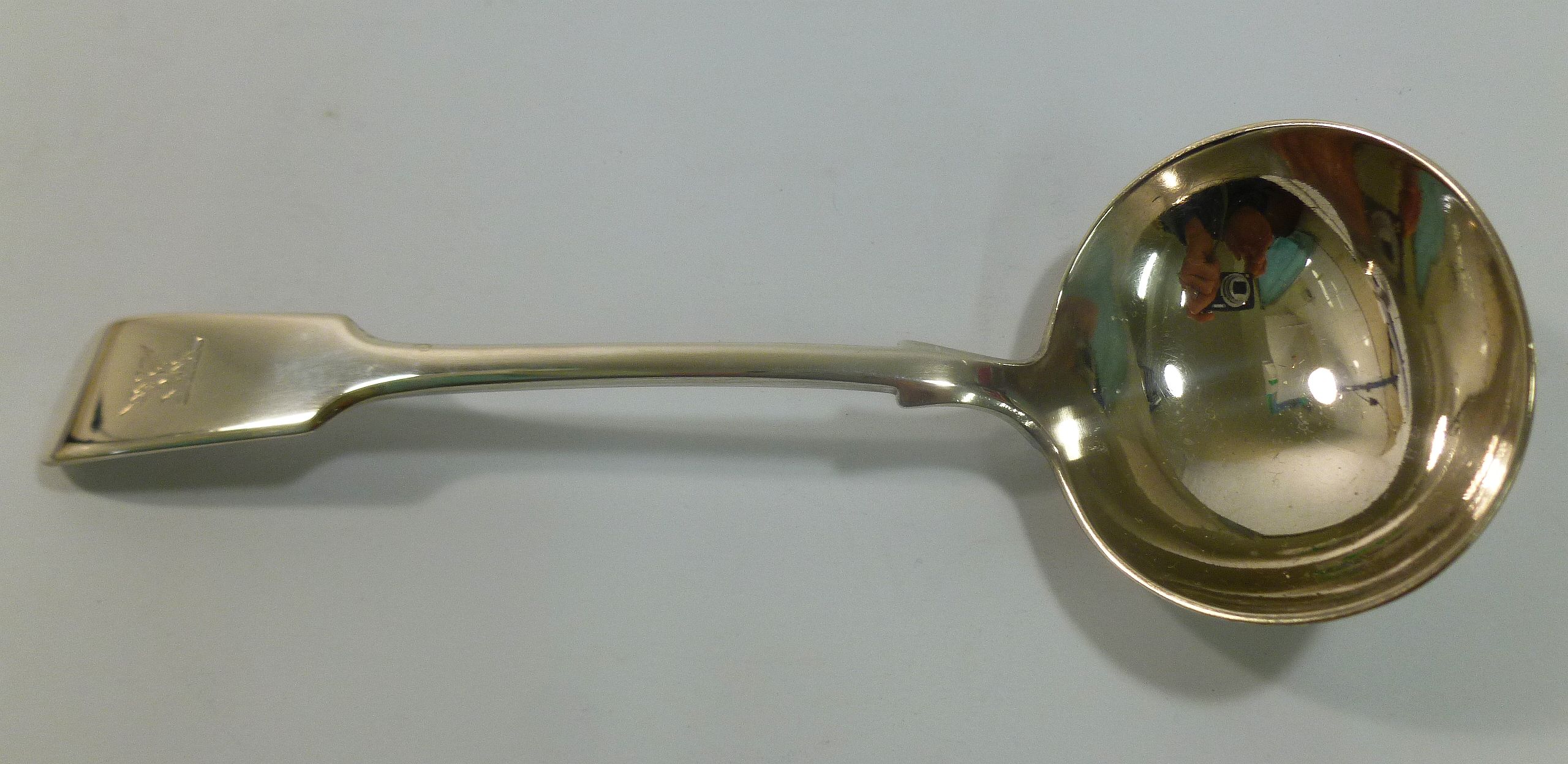 A Victorian silver fiddle pattern sauce ladle, London 1874, 18.1cm long, 2.16ozt, 67.