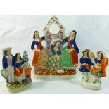 A Stafforshire pottery flatback pocket watch stand in the form of three Scottish ladies dancing,