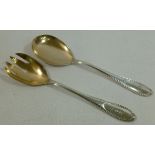 A pair of German silver salad servers with gilded bowls, circa 1920, spoon 21.