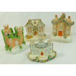 Four Staffordshire pottery pastille burners in the form of castles and a cottage and a small