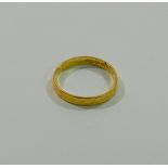 A 22 carat gold wedding band, hallmarks rubbed, possibly London 1972, 2.