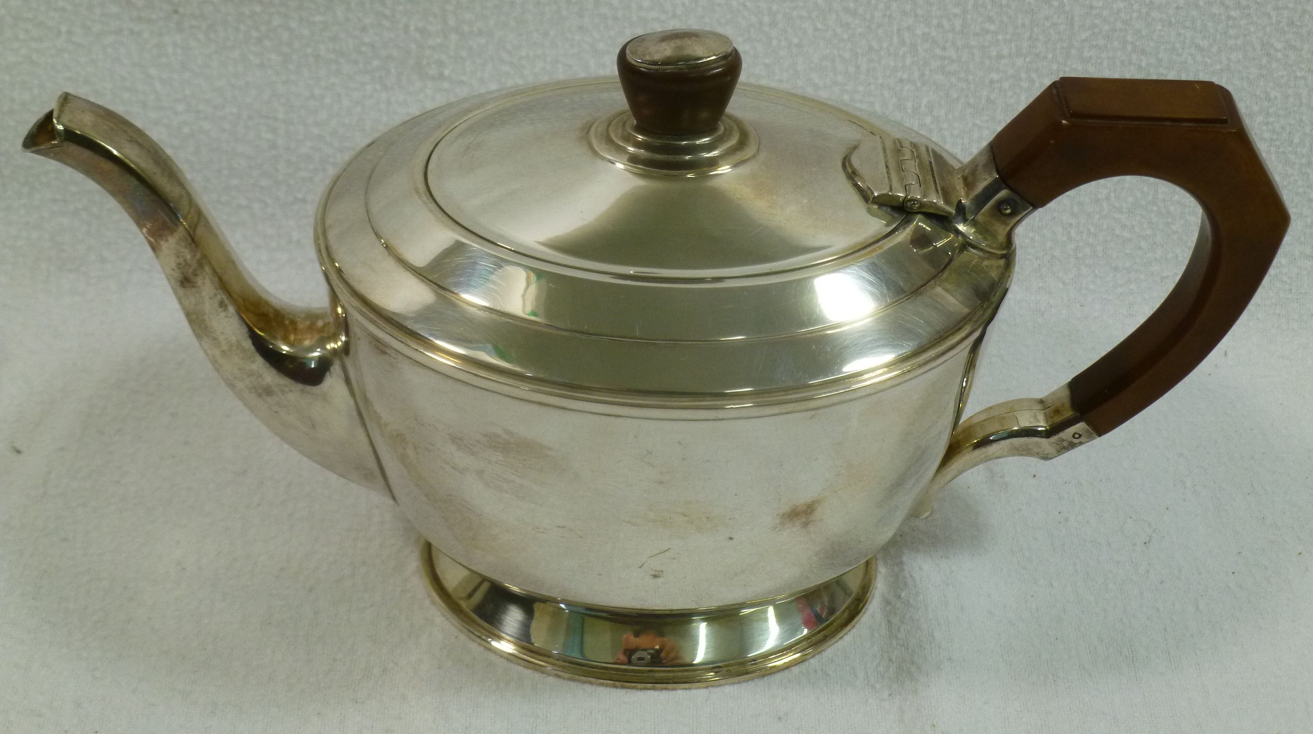 A silver three piece teaset comprised of a teapot with bakelite handle and knop, - Image 2 of 2