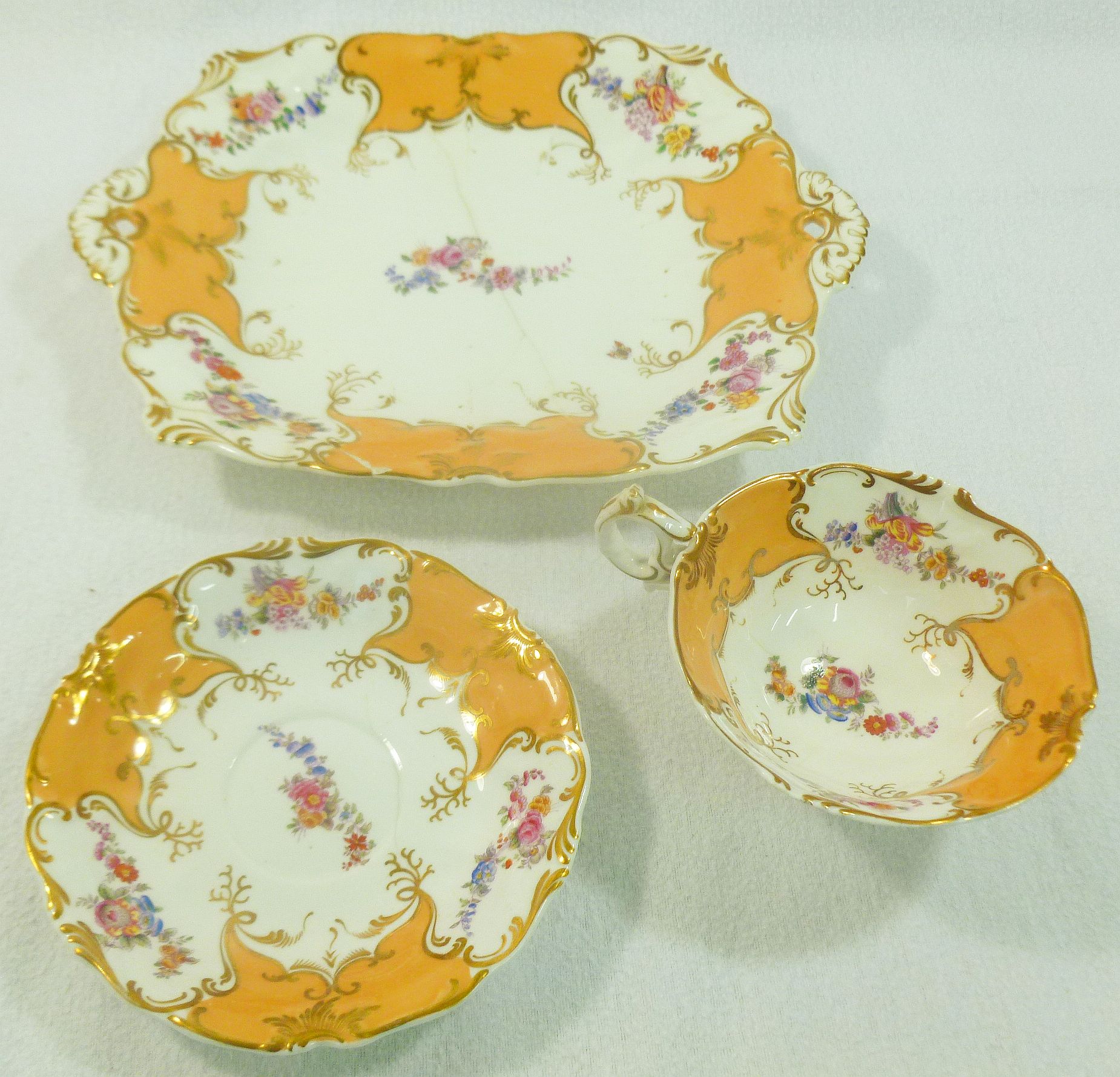 Three pieces of H & R Daniel porcelain comprised of a bread and butter plate, 28cm long,