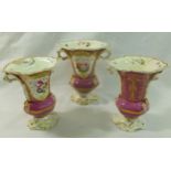 A garniture of three 19th century porcelain vases, pattern number 646, with puce ground,