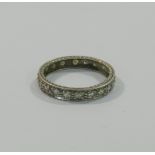 An early 20th century diamond and platinum eternity ring,