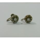 A pair of diamond circular cluster earrings, the centre round brilliant cut diamond approximately 0.