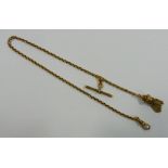 A Victorian gold watch chain, with tassel end and 'T' bar, unmarked, 39cm long, 15.