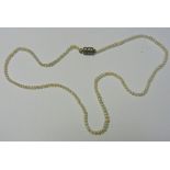 A string of natural salt water seed pearls, the largest 2.