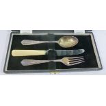 A silver three piece christening set, comprised of a spoon and fork, Sheffield 1950,