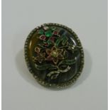 A Victorian oval banded agate brooch over set with diamonds, emeralds, rubies,
