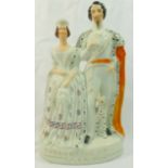 A Victorian Staffordshire pottery flatback figural group of Queen Victoria and King Victor Emmanuel