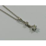 A diamond two-stone pendant and chain, the round brilliant cut stones approximately 0.40 and 0.